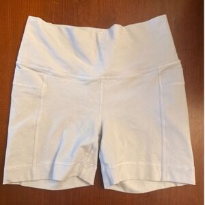Athleta Girl bike shorts Right Moves Stash 4" inseam pockets L girl 12 pale blue
